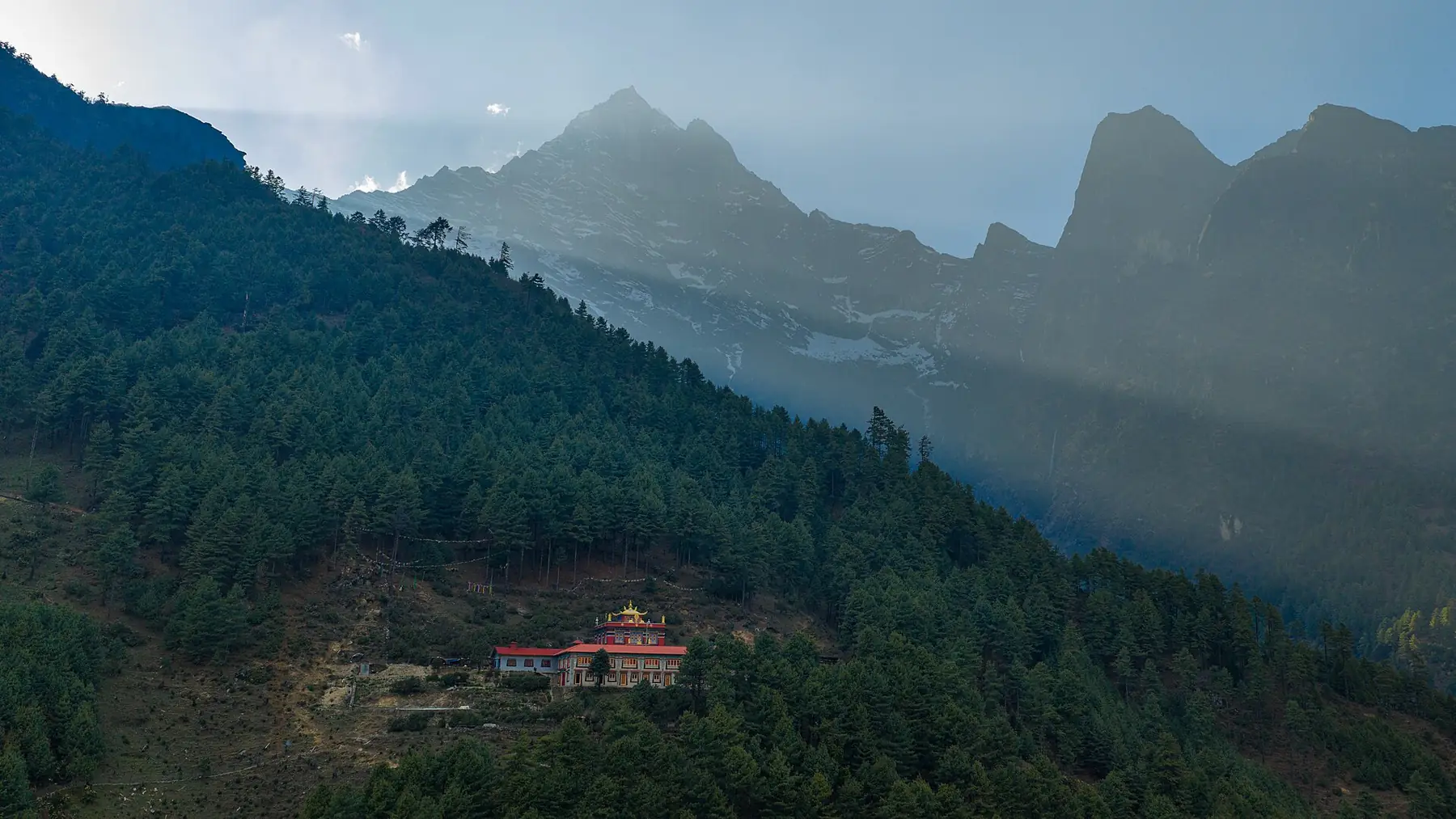 Small Phakding Monastery Below Giant Wild Himalayan Mountains — in the Everest (Khumbu) region
